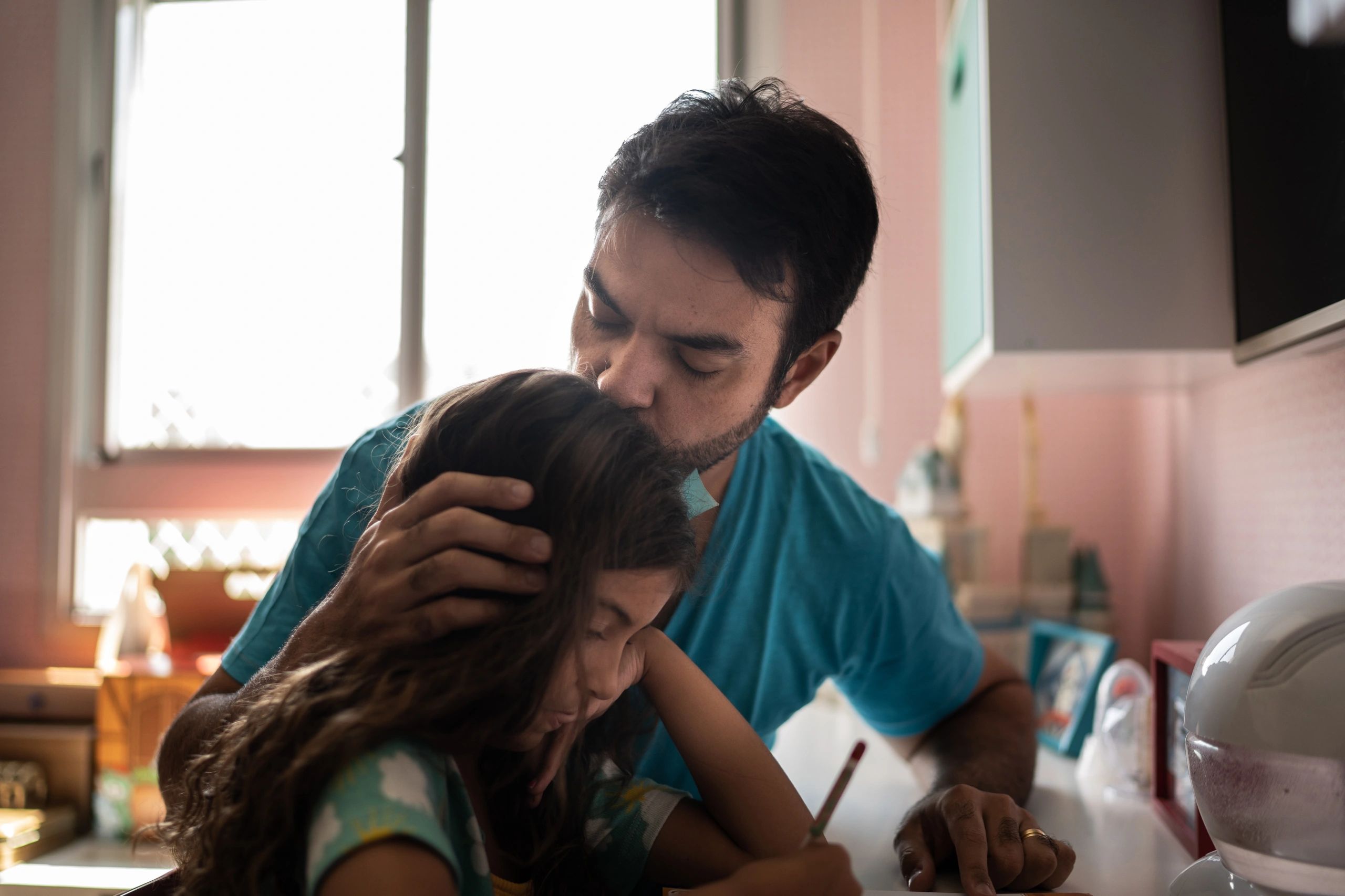 Parent supporting child during study time