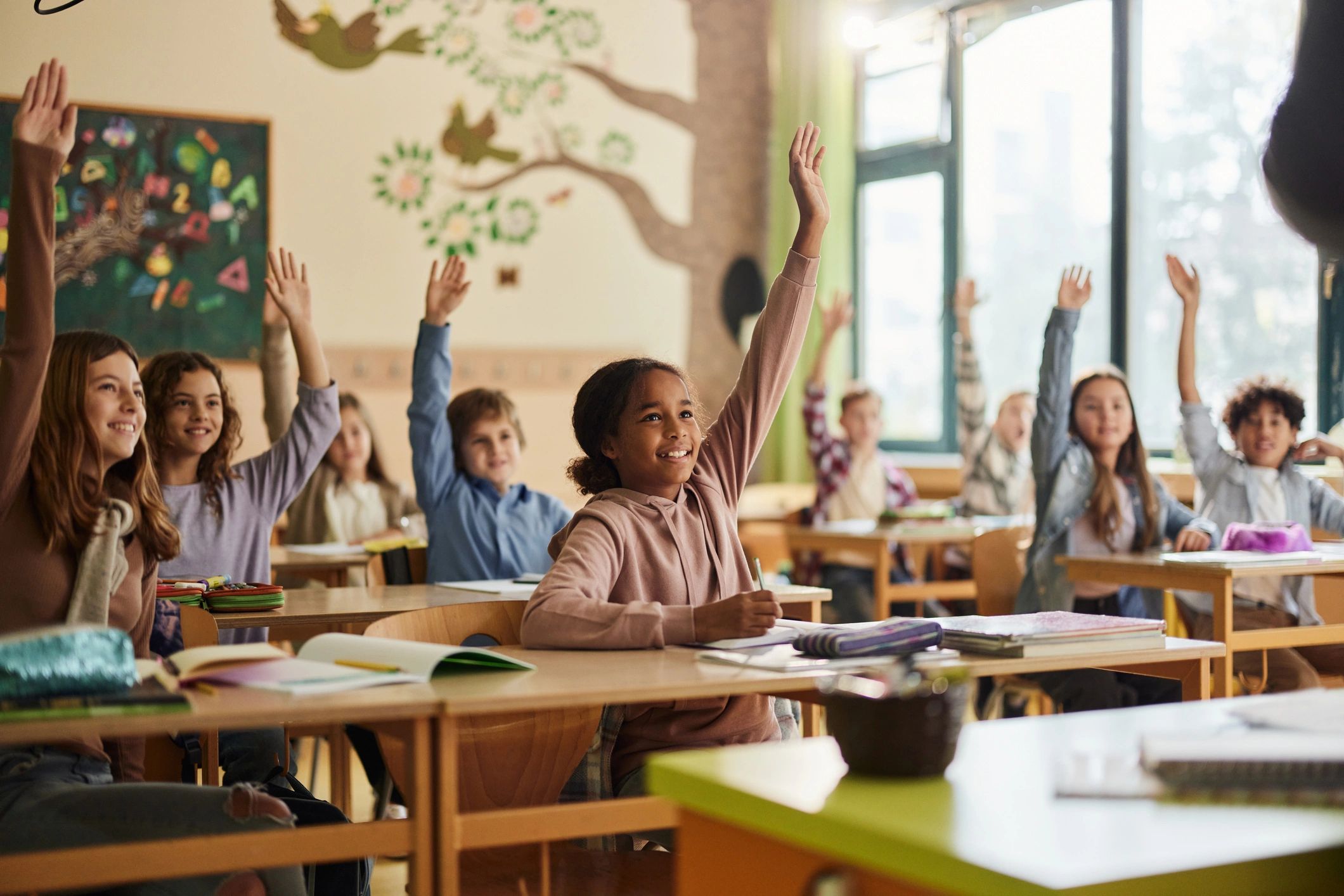 Elementary students engaged in a lively classroom lesson